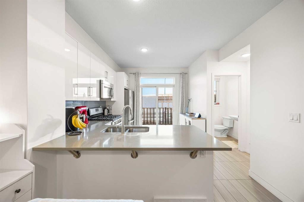 87 Walden Path Se, Calgary, AB - Indoor Photo Showing Kitchen With Double Sink