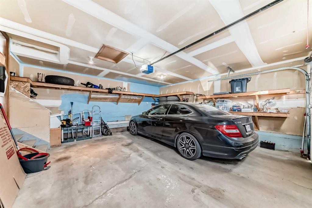 128-7707 Martha'S Haven Park Ne, Calgary, AB - Indoor Photo Showing Garage