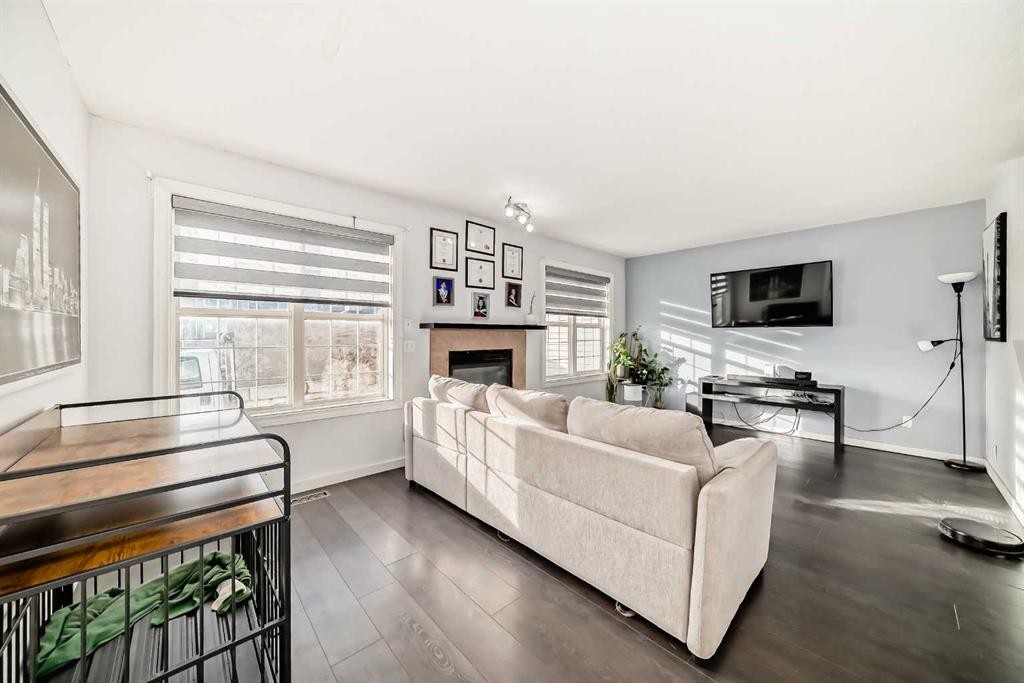 128-7707 Martha'S Haven Park Ne, Calgary, AB - Indoor Photo Showing Living Room With Fireplace