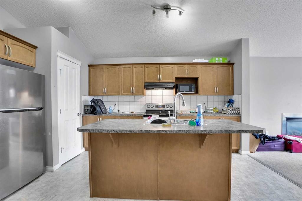 250 Martinwood Place Ne, Calgary, AB - Indoor Photo Showing Kitchen With Double Sink