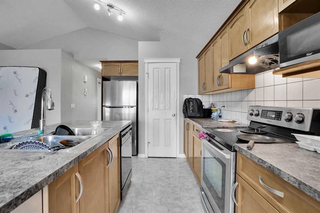 250 Martinwood Place Ne, Calgary, AB - Indoor Photo Showing Kitchen With Double Sink