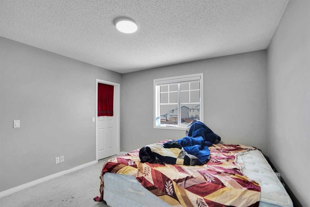 250 Martinwood Place Ne, Calgary, AB - Indoor Photo Showing Bedroom