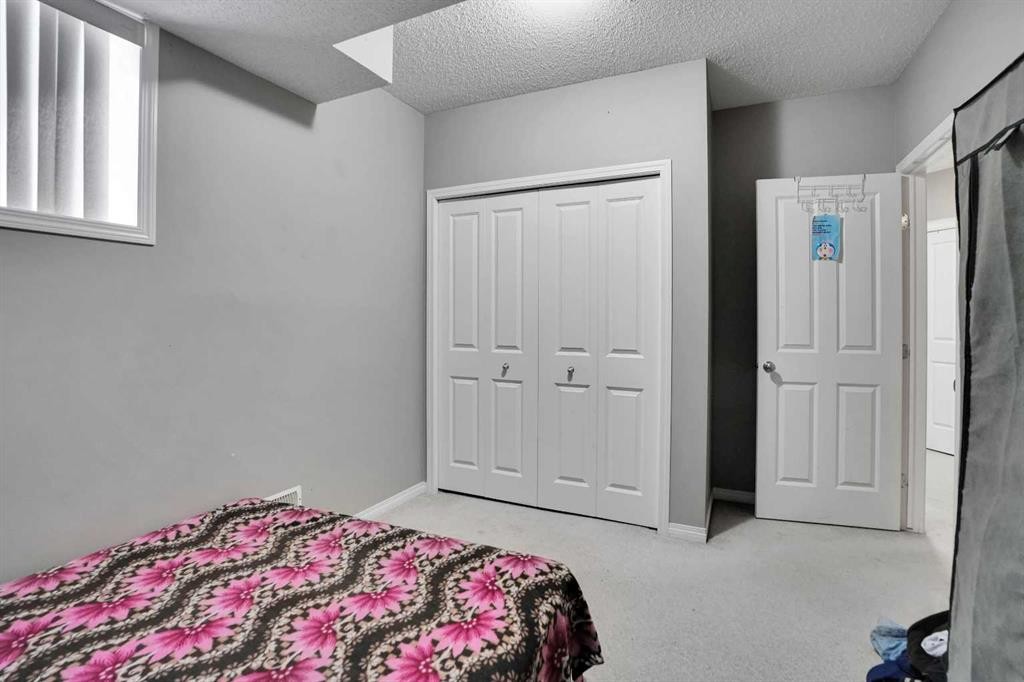 250 Martinwood Place Ne, Calgary, AB - Indoor Photo Showing Bedroom