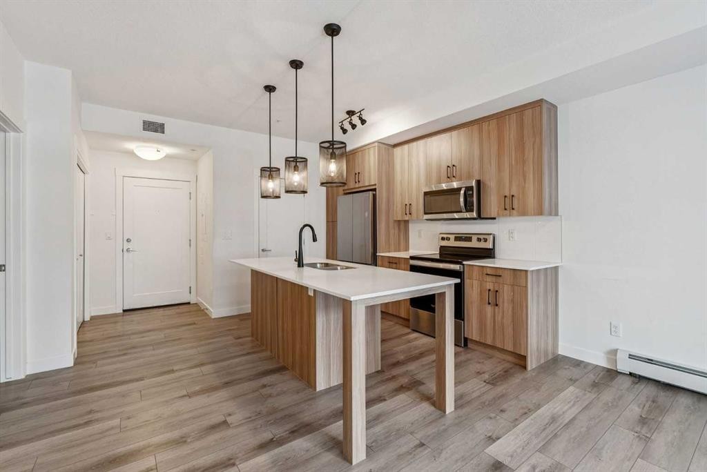 203-500 Auburn Meadows Common Se, Calgary, AB - Indoor Photo Showing Kitchen With Stainless Steel Kitchen With Upgraded Kitchen