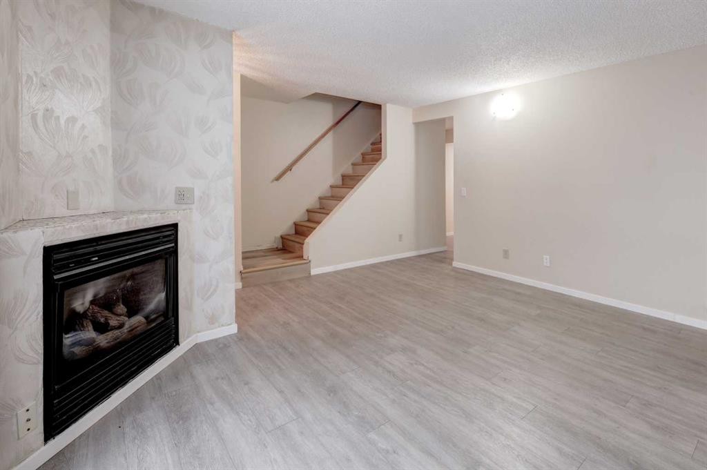 417 40 Street Ne, Calgary, AB - Indoor With Fireplace