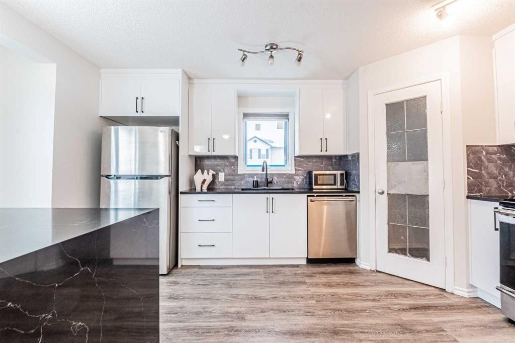 913 Taradale Drive Ne, Calgary, AB - Indoor Photo Showing Kitchen With Stainless Steel Kitchen