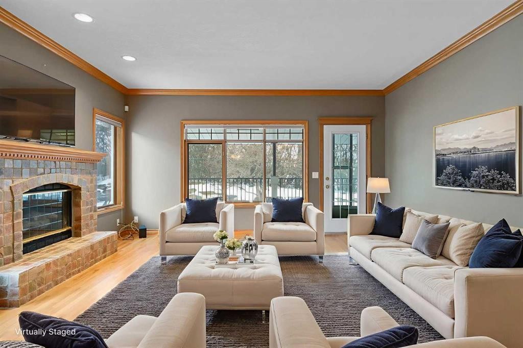 12 Prominence Point Sw, Calgary, AB - Indoor Photo Showing Living Room With Fireplace