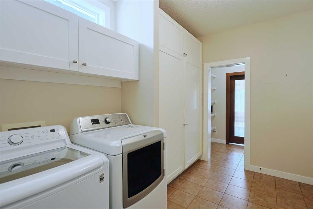55 Tuscany Estates Drive Nw, Calgary, AB - Indoor Photo Showing Laundry Room