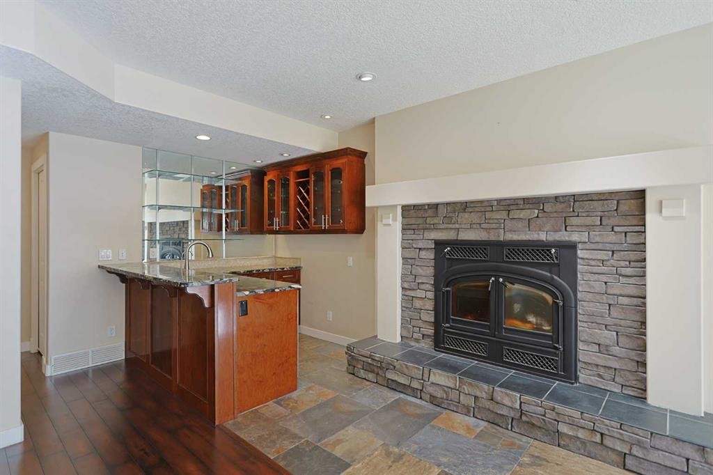 55 Tuscany Estates Drive Nw, Calgary, AB - Indoor Photo Showing Living Room With Fireplace