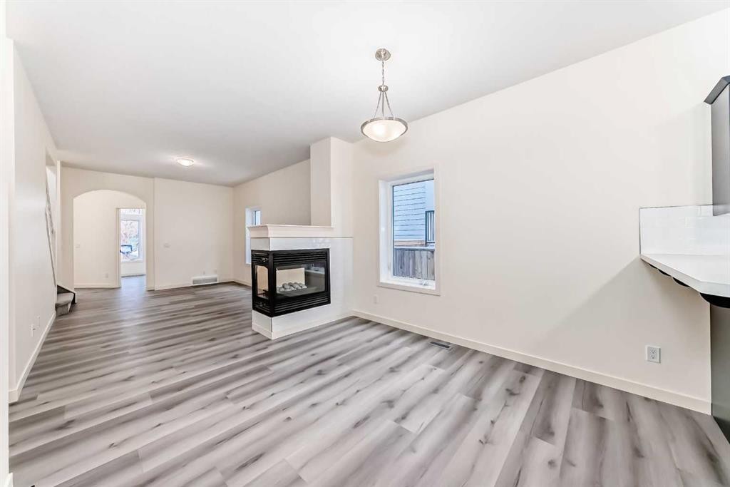 2006 37 Street Se, Calgary, AB - Indoor Photo Showing Living Room With Fireplace