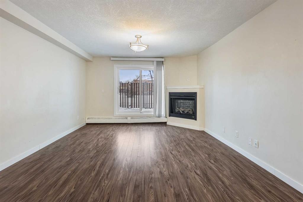 101-3747 42 Street Nw, Calgary, AB - Indoor With Fireplace