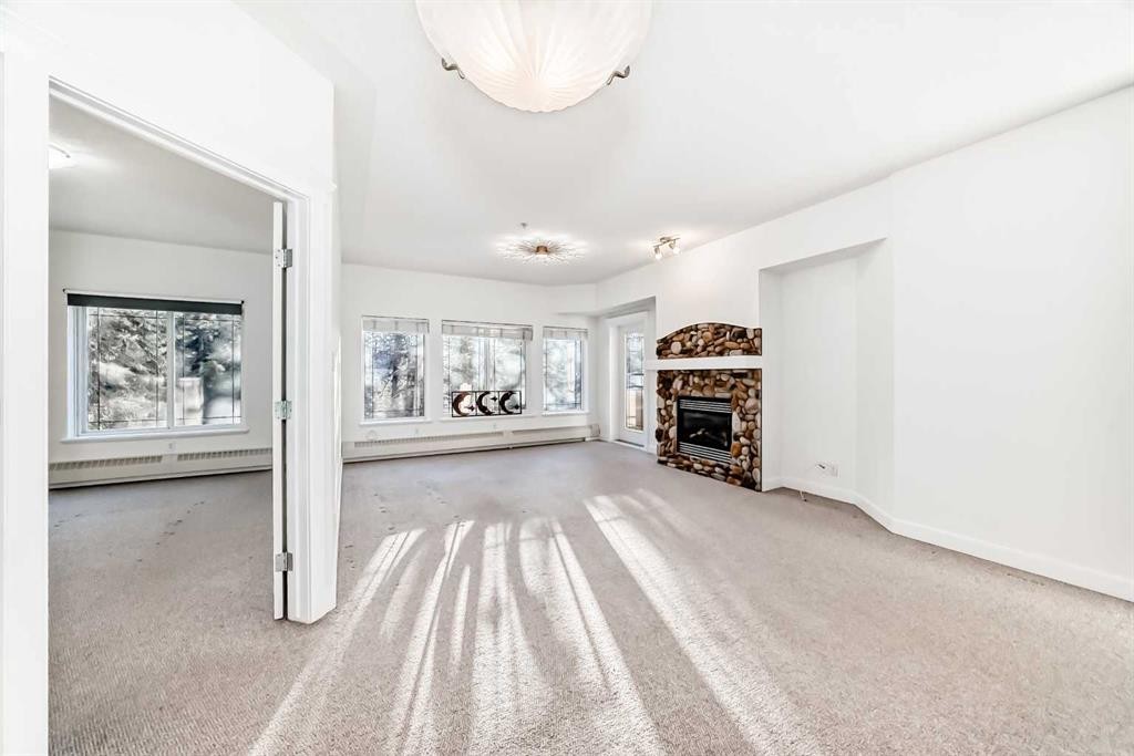 213-10 Discovery Ridge Close Sw, Calgary, AB - Indoor With Fireplace