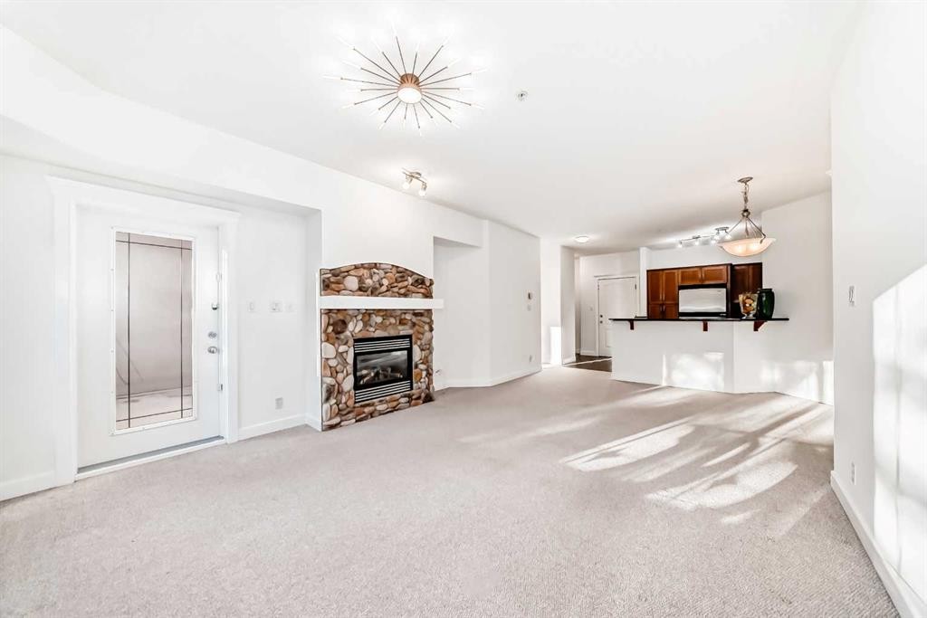 213-10 Discovery Ridge Close Sw, Calgary, AB - Indoor With Fireplace