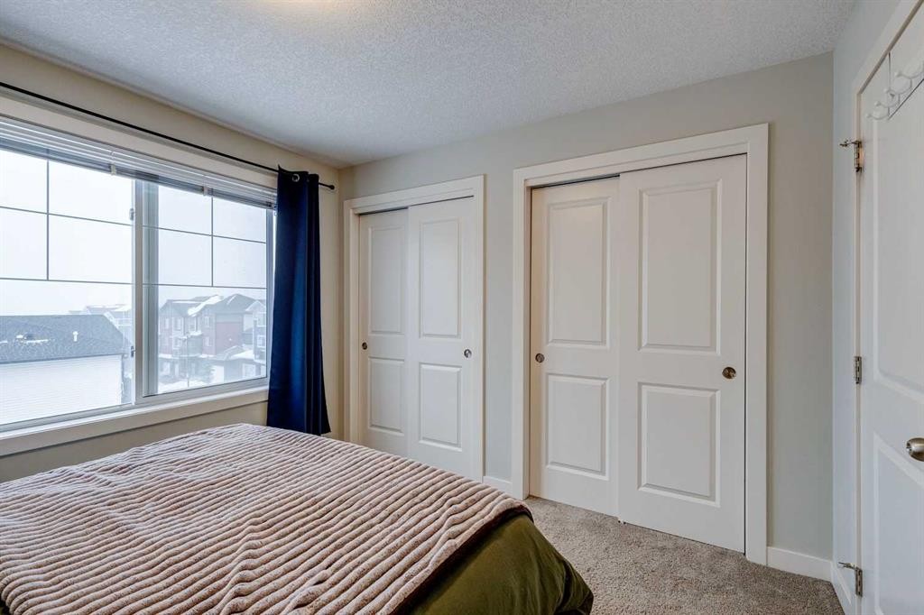 2103 Jumping Pound Common, Cochrane, AB - Indoor Photo Showing Bedroom