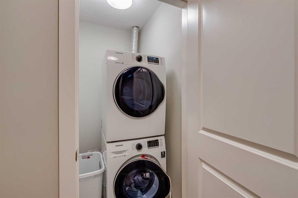 2103 Jumping Pound Common, Cochrane, AB - Indoor Photo Showing Laundry Room
