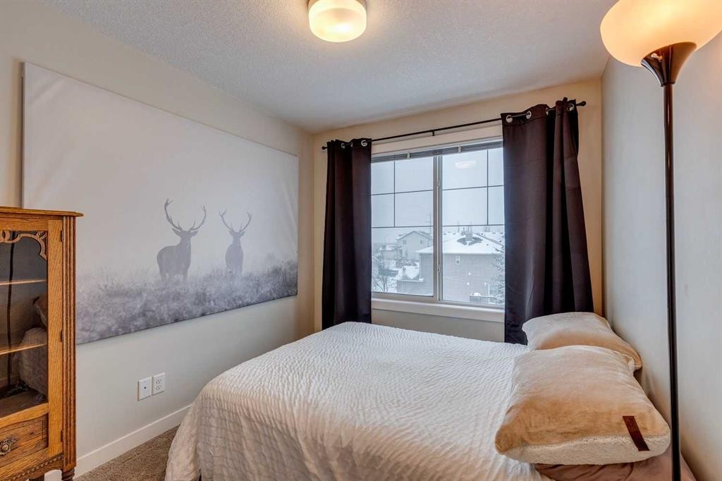 2103 Jumping Pound Common, Cochrane, AB - Indoor Photo Showing Bedroom
