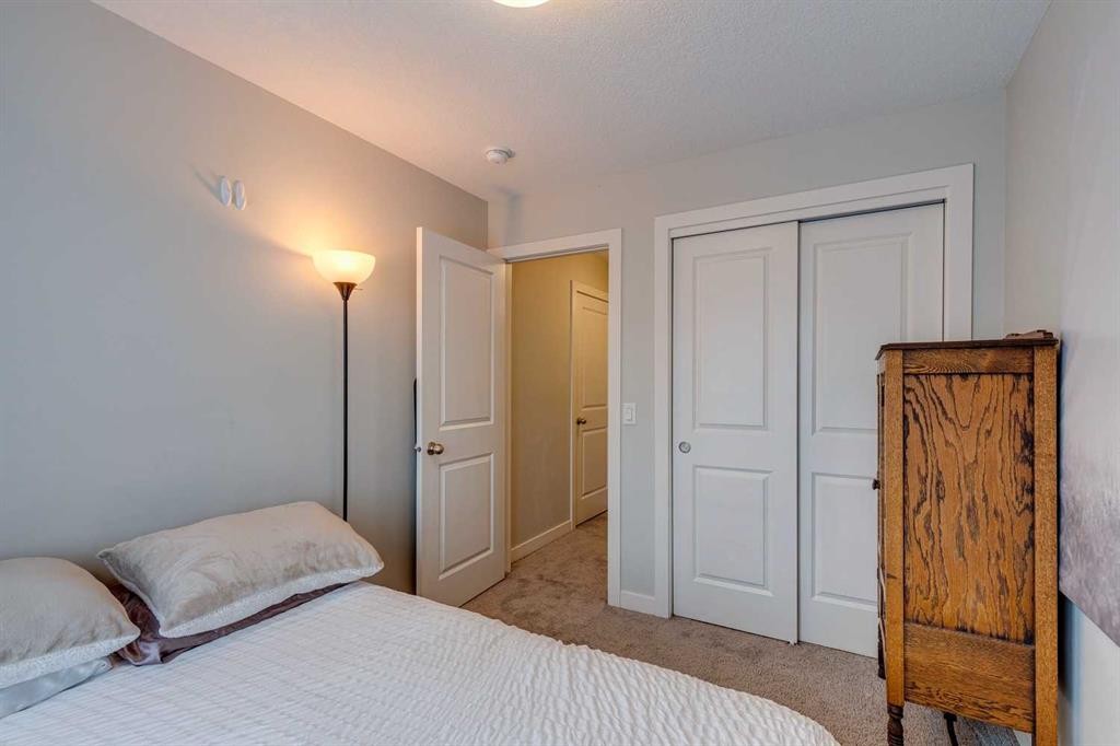 2103 Jumping Pound Common, Cochrane, AB - Indoor Photo Showing Bedroom