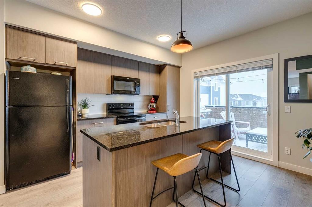 2103 Jumping Pound Common, Cochrane, AB - Indoor Photo Showing Kitchen