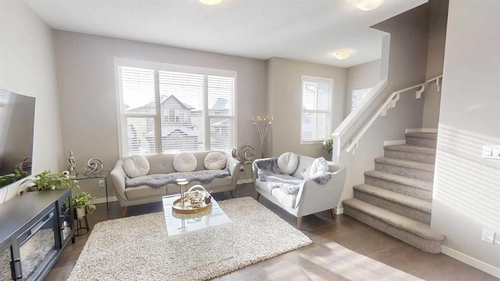 165 Panatella Square Nw, Calgary, AB - Indoor Photo Showing Living Room