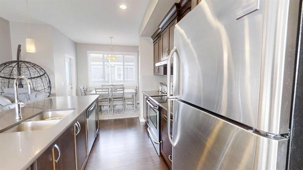 165 Panatella Square Nw, Calgary, AB - Indoor Photo Showing Kitchen With Double Sink With Upgraded Kitchen