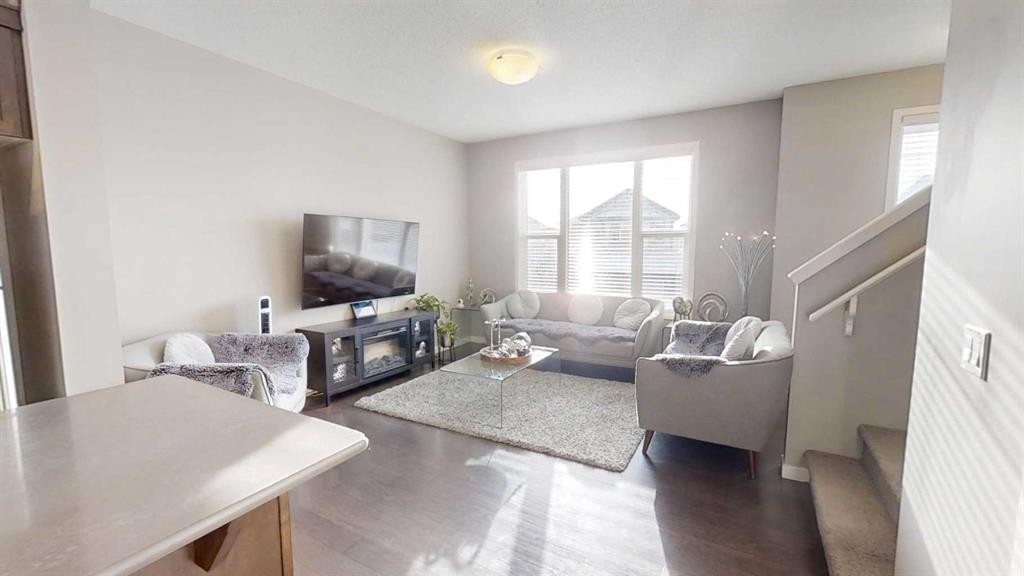 165 Panatella Square Nw, Calgary, AB - Indoor Photo Showing Living Room