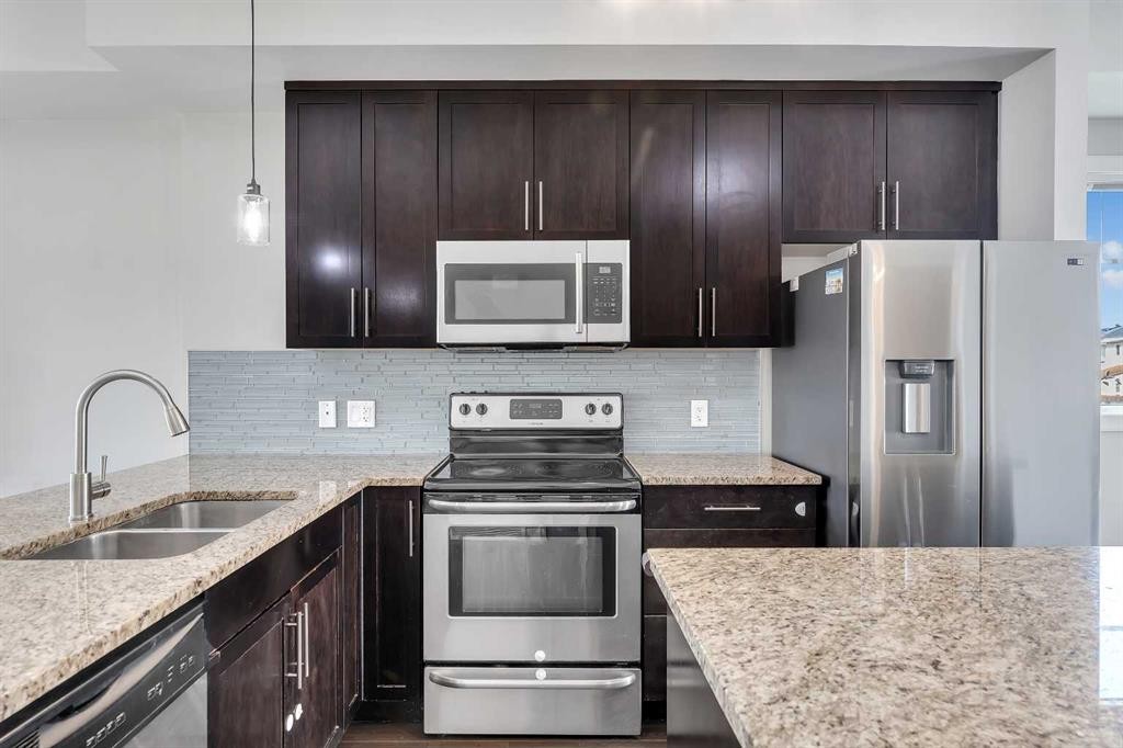 23 Redstone Circle Ne, Calgary, AB - Indoor Photo Showing Kitchen With Double Sink With Upgraded Kitchen
