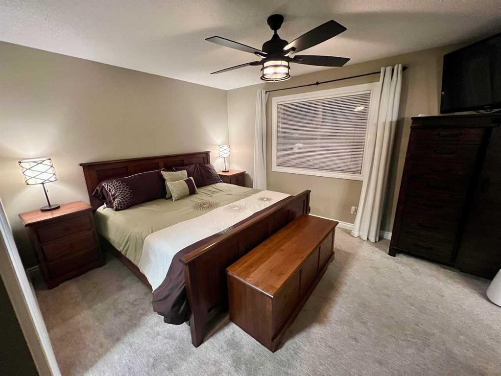 2117 Reunion Boulevard Nw, Airdrie, AB - Indoor Photo Showing Bedroom
