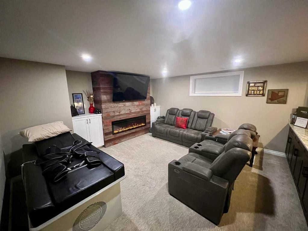 2117 Reunion Boulevard Nw, Airdrie, AB - Indoor Photo Showing Basement With Fireplace