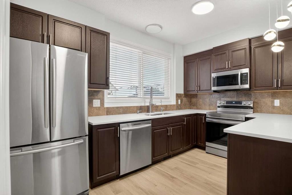 104 Masters Link Se, Calgary, AB - Indoor Photo Showing Kitchen With Stainless Steel Kitchen