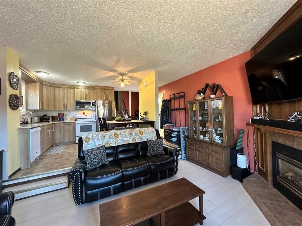 136 Templeby Place Ne, Calgary, AB - Indoor Photo Showing Living Room With Fireplace