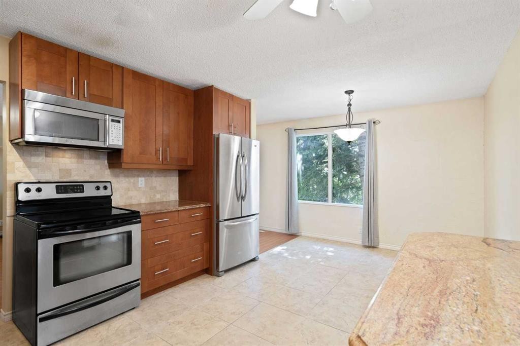 84 Maranda Close Ne, Calgary, AB - Indoor Photo Showing Kitchen With Stainless Steel Kitchen