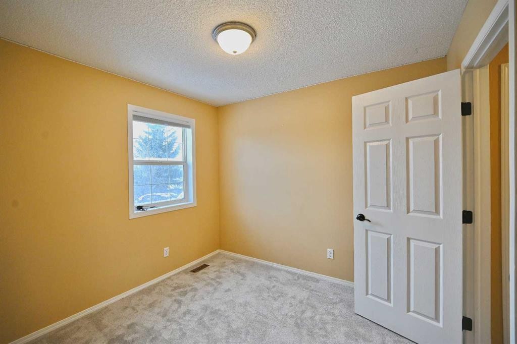 68 Covepark Close Ne, Calgary, AB - Indoor Photo Showing Other Room