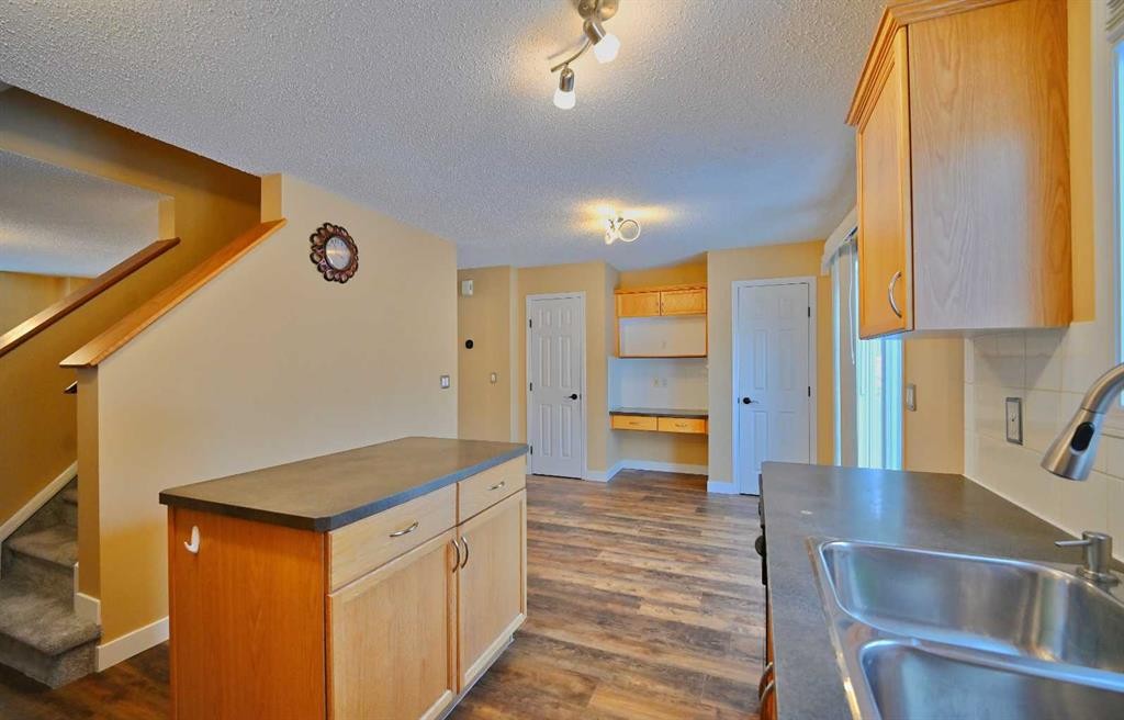 68 Covepark Close Ne, Calgary, AB - Indoor Photo Showing Kitchen With Double Sink