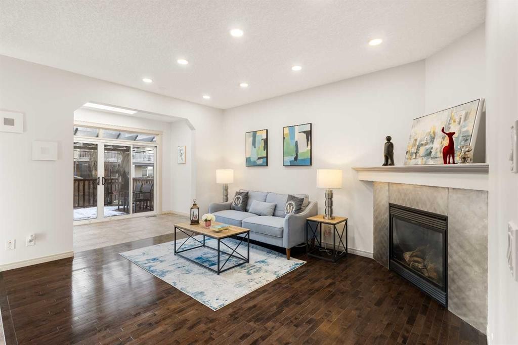 21 Panamount Row Nw, Calgary, AB - Indoor Photo Showing Living Room With Fireplace