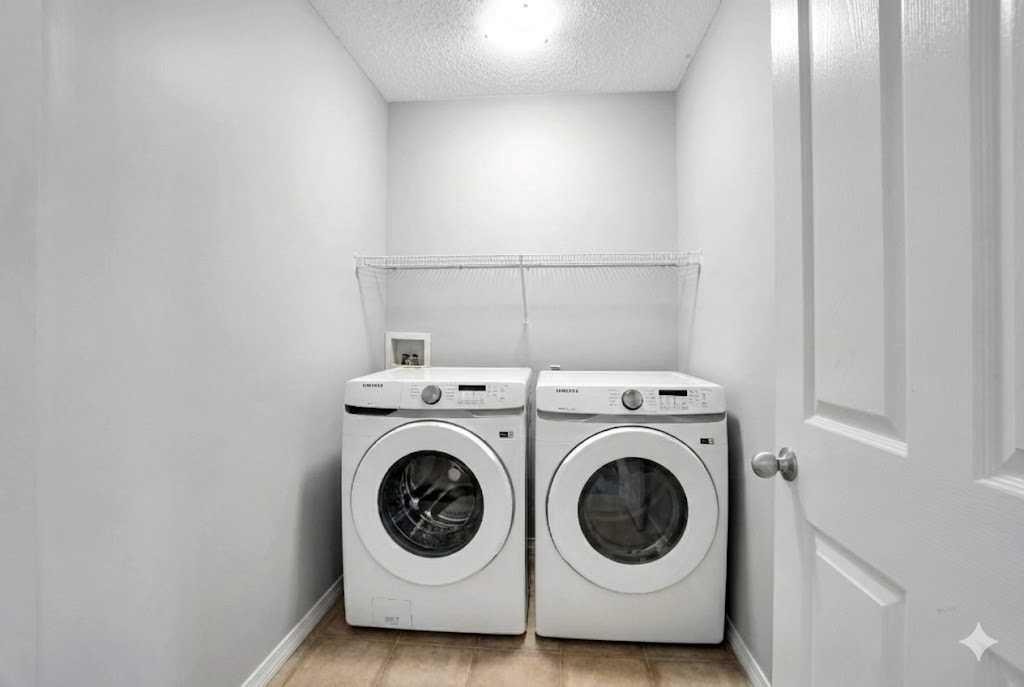 9214 Saddlebrook Drive Ne, Calgary, AB - Indoor Photo Showing Laundry Room
