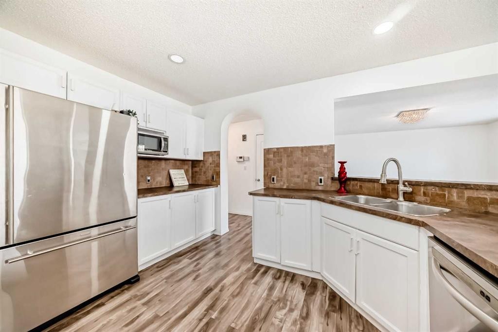 120 Springmere Grove, Chestermere, AB - Indoor Photo Showing Kitchen With Stainless Steel Kitchen With Double Sink