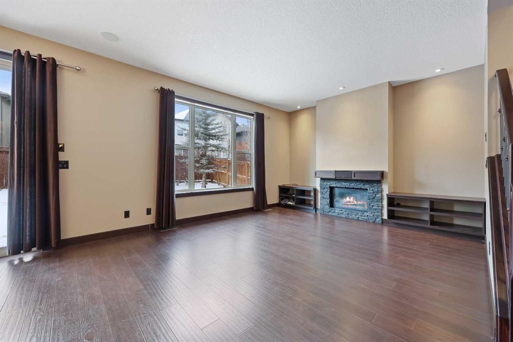 226 Sage Meadows Circle Nw, Calgary, AB - Indoor Photo Showing Other Room With Fireplace