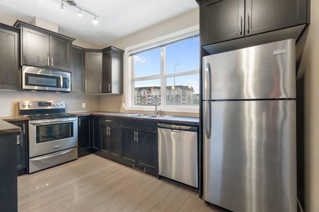 428 Redstone View Ne, Calgary, AB - Indoor Photo Showing Kitchen With Stainless Steel Kitchen With Double Sink With Upgraded Kitchen