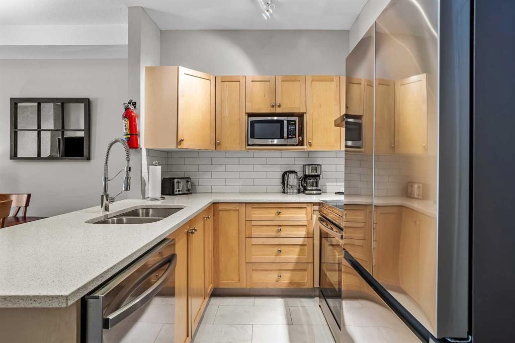 106-107 Montane Road, Canmore, AB - Indoor Photo Showing Kitchen With Double Sink