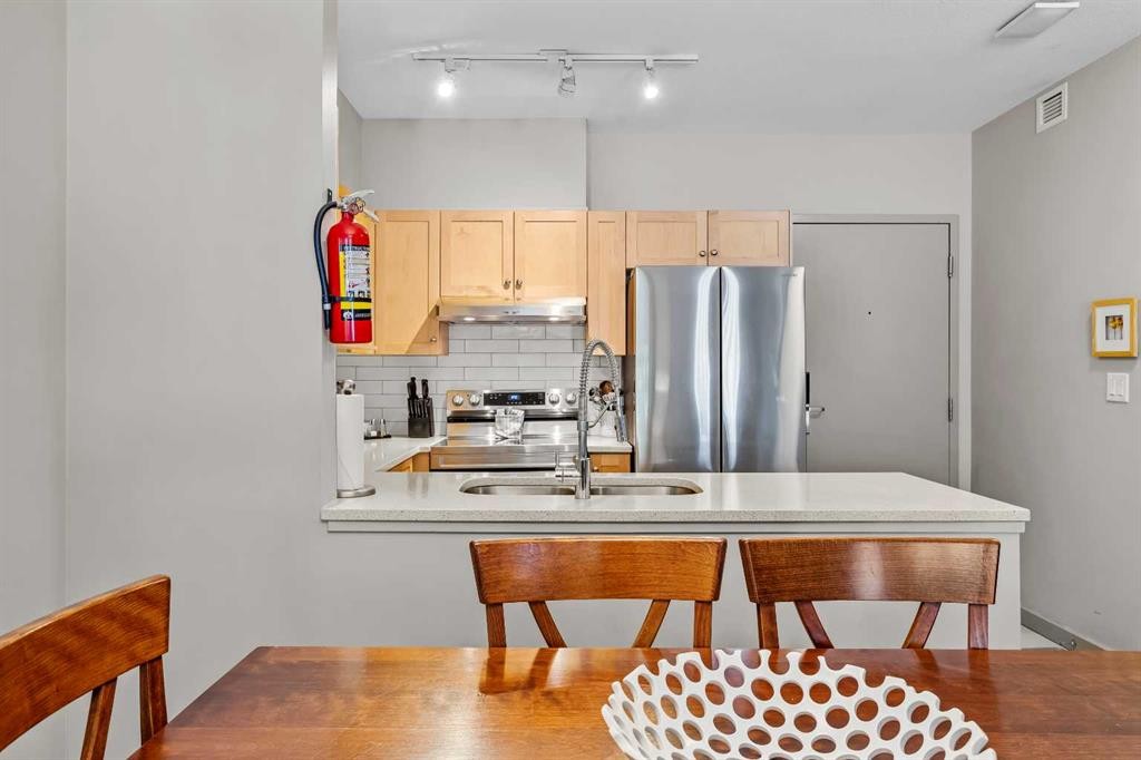 106-107 Montane Road, Canmore, AB - Indoor Photo Showing Kitchen With Double Sink
