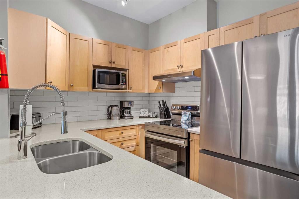 106-107 Montane Road, Canmore, AB - Indoor Photo Showing Kitchen With Double Sink