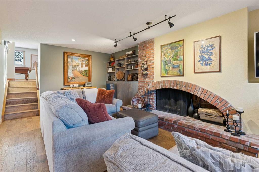 5031 Viceroy Drive Nw, Calgary, AB - Indoor Photo Showing Living Room With Fireplace