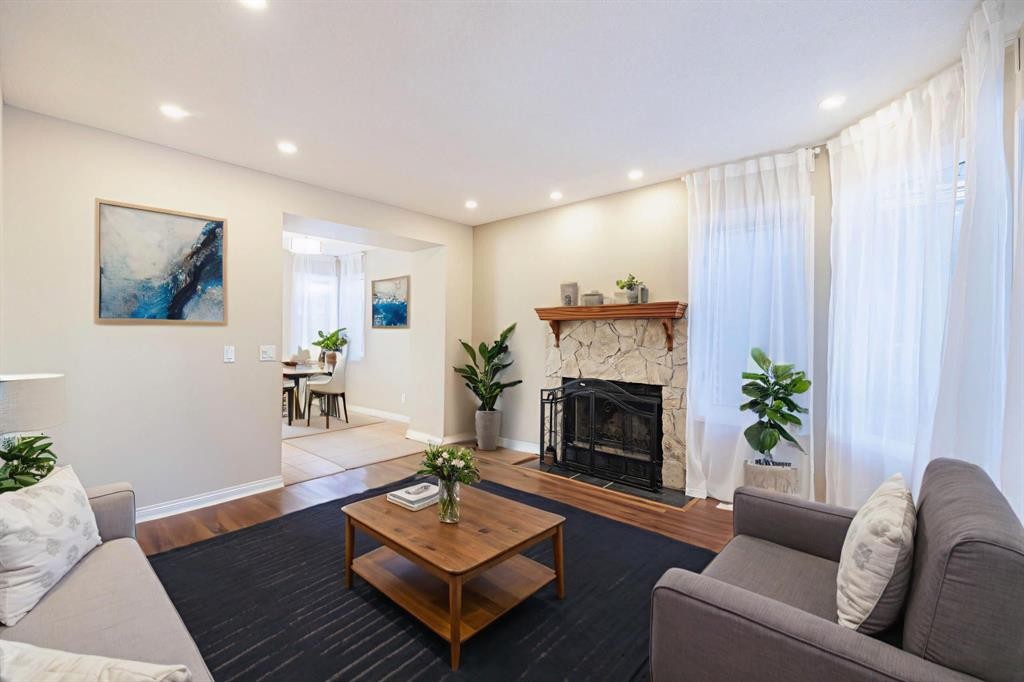 44 Macewan Ridge Close Nw, Calgary, AB - Indoor Photo Showing Living Room With Fireplace