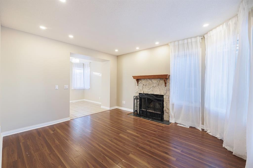 44 Macewan Ridge Close Nw, Calgary, AB - Indoor Photo Showing Other Room With Fireplace