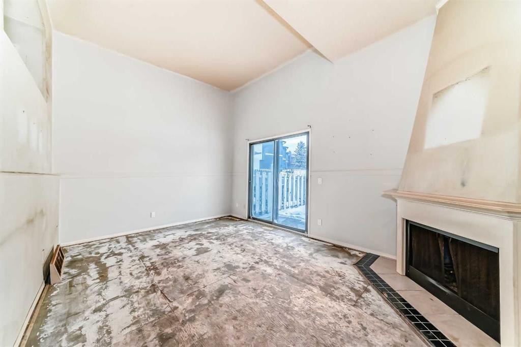 1802-919 38 Street Ne, Calgary, AB - Indoor Photo Showing Other Room With Fireplace