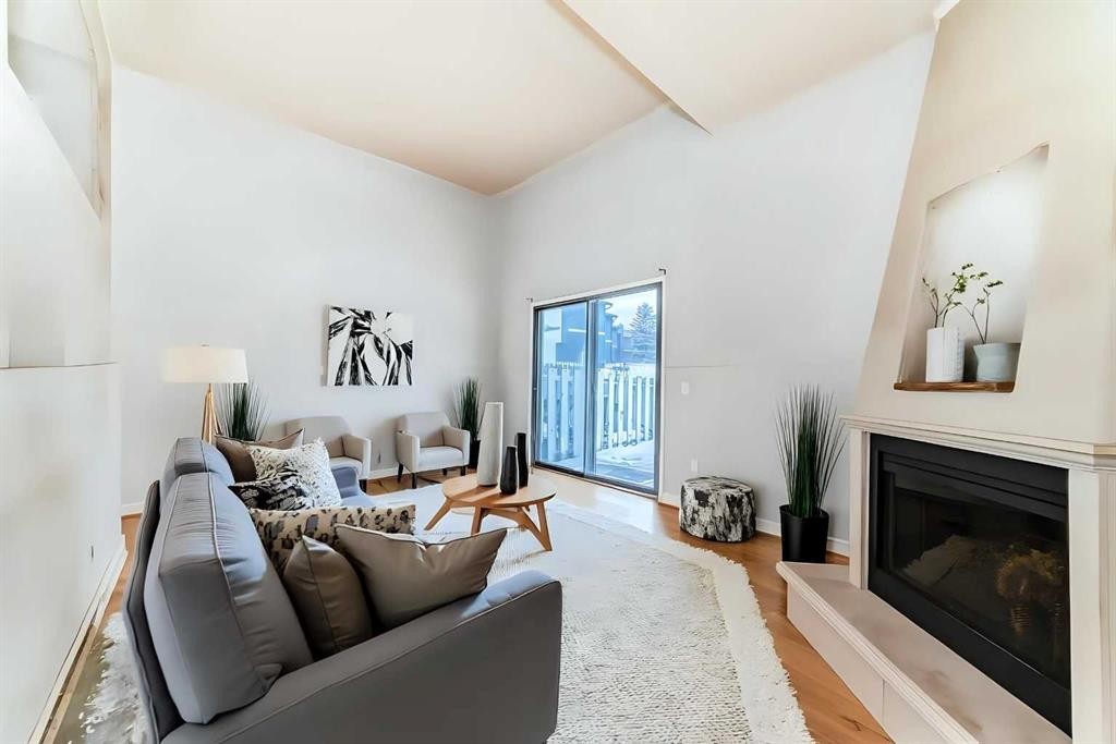 1802-919 38 Street Ne, Calgary, AB - Indoor Photo Showing Living Room With Fireplace