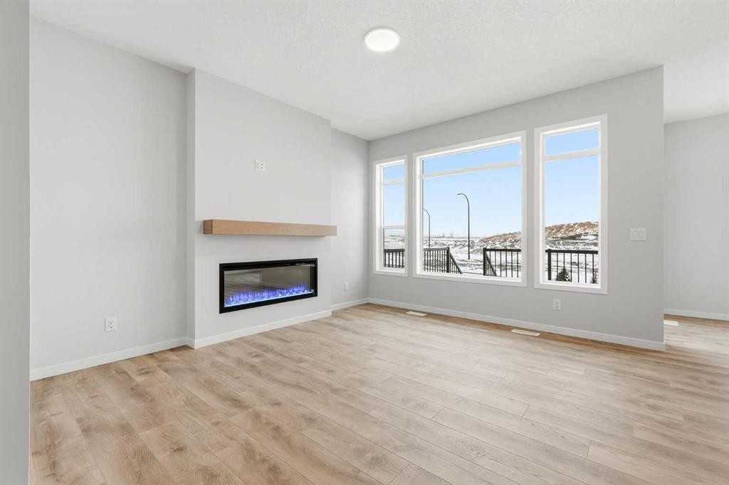 170 Herron Way Ne, Calgary, AB - Indoor Photo Showing Living Room With Fireplace
