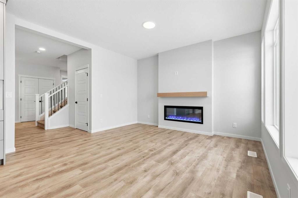 170 Herron Way Ne, Calgary, AB - Indoor Photo Showing Living Room With Fireplace