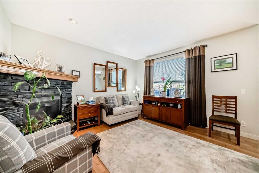 198 Brightonstone Bay Se, Calgary, AB - Indoor Photo Showing Living Room With Fireplace