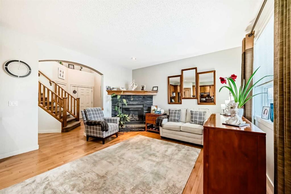 198 Brightonstone Bay Se, Calgary, AB - Indoor Photo Showing Living Room With Fireplace